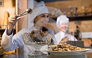 Women selling tarts and sweet pastry