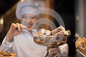 Women selling tarts and sweet pastry