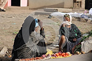 Women selling vegetables on street market