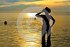 Women shape silhouette with bikini