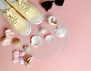 Women shoes , Relax Time Sneakers  yellow shoe , sunglasses ,seashell and flowers on  pink blue background ,clothes  accessories s