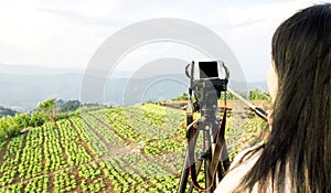 Women shooting photo or video of landscape sky and mountain nature view