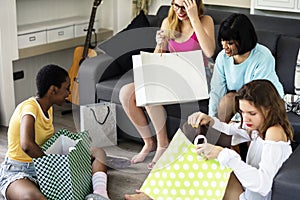 Women showing friends shopping shoes