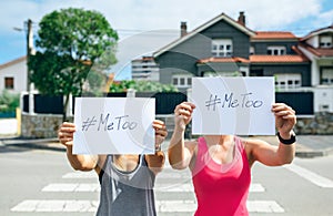 Women showing poster with metoo hashtag photo