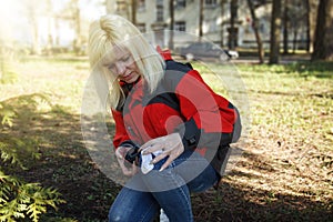 Women sign geocaching logbook photo