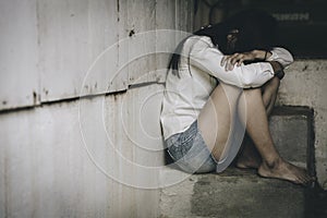 Women sitting on the floor  with depression,  family problems,  Domestic violence, Stop violence and abuse ,sexual abuse, human photo