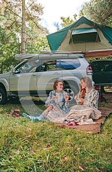 Women sitting under blanket with 4x4 on background