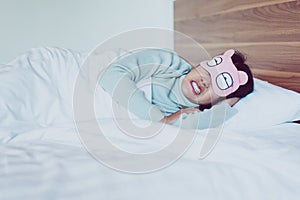 Woman sleeping on the bed and grinding teeth,Female tiredness and stress photo