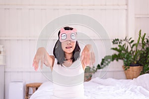 Woman sleepwalker with somnambulism sleep and walking in bedroom photo
