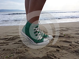 Women sneakers in beach