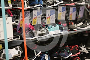 Women sneakers on a shelf in the French sporting goods retailer Decathlon