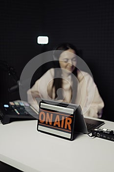 Women speaking during radio program in studio