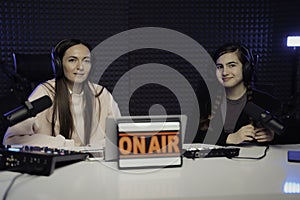 Women speaking during radio program in studio