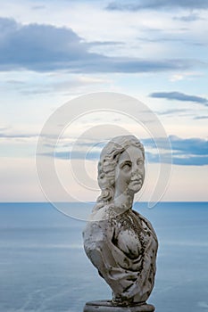 Women Statue from the belvedere, the so-called Terrazza dell`infinito, The Terrace of Infinity seen on the sunset, Villa Cimbrone,