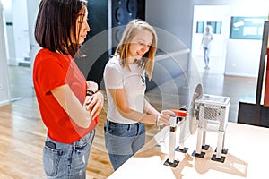 Students making experimental work in the field of mechanics and physics in modern laboratory