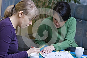 Women studying house plan