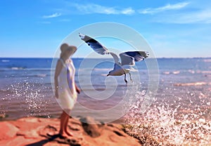 women in summer dress  hat on beach seagull on pier at sea water wave reflection blue sky travel leisure island c