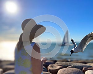 Women in summer hat silouettfe and seagull fly  at sea  horizon yachting water wave light reflection  landscape