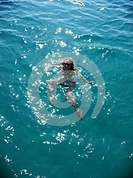 Women swims in the sea