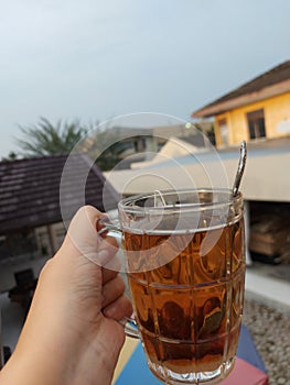 Women take a hot tea in upstair house