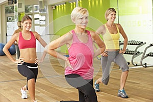 Women Taking Part In Gym Fitness Class