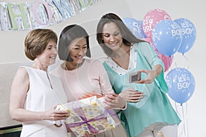 Women Taking Self-Portrait At A Baby Shower