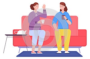 Women talking on couch. Friends drink coffee at home