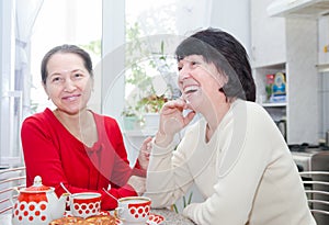 Women talking at kitchen table