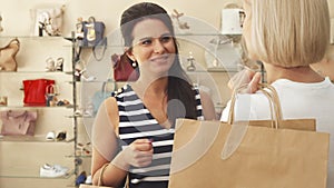 Women talking in shoe shop