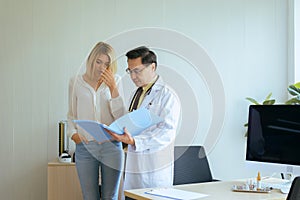 Women talking to doctor psychiatrist in hospital,Discuss issue and find solutions to mental health problems