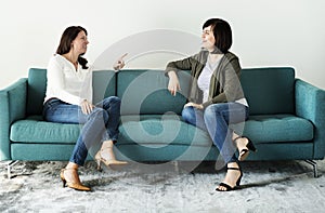 Women talking together on the couch