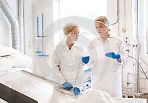 Women technologists working at ice cream factory