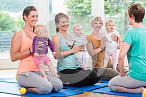 Women and their babies in mother-child gymnastic course