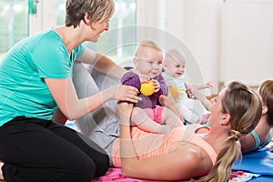 Women and their babies in mother-child gymnastic course