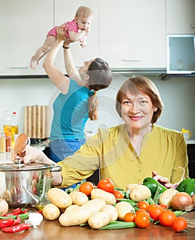 Women of three generations in domestic kitchen