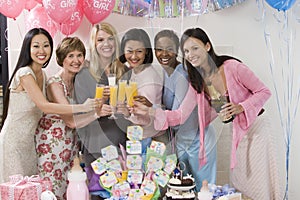 Women Toasting Drinks At A Baby Shower photo