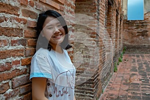 Women tourist at ancient temple in Thailand