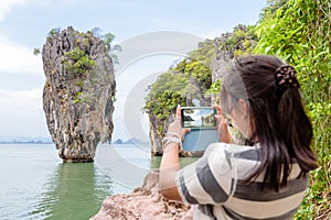 Women tourist shooting natural view by mobile phone