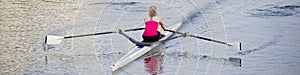 Women training on canoe to practise rowing during early morning on river