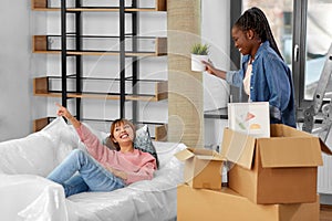 women unpacking boxes and moving to new home