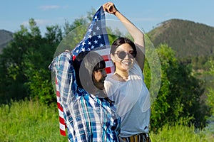 Women with USA flag, celebration of patriotic american national holiday 4th of july independence day