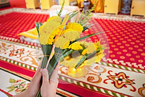 Women are using candles, flowers, incense, pray for priests.