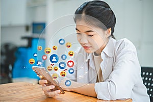 Women using their phones to connect on social media. Different symbols and viewpoints are acknowledged. notion of social media