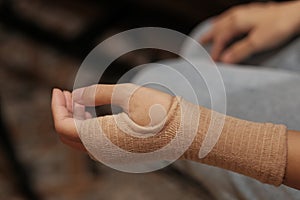 Women using a Tubular Bandage for provide tissue support in treating strains