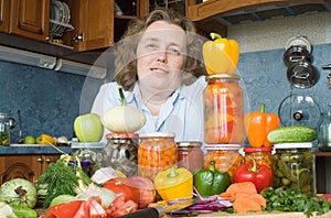 Women with vegetables and jars photo