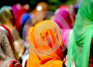 Women with very colorful veils