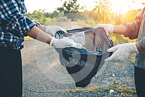 Women volunteer help garbage collection charity.