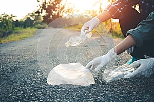 Women volunteer help garbage collection charity.