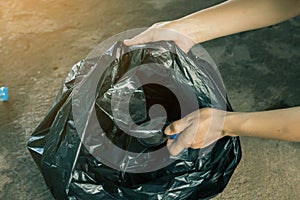 Women volunteer help garbage collection charity.