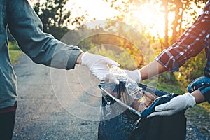 Women volunteer help garbage collection charity.